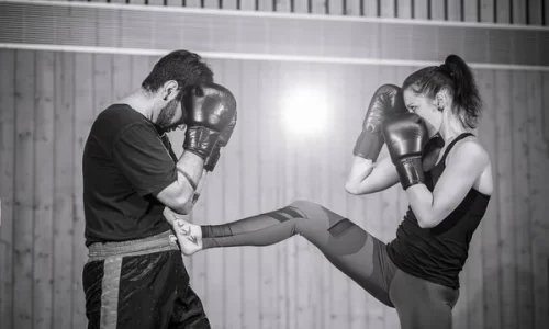 depositphotos_468754330-stock-photo-female-kickboxer-sparring-coach-sports